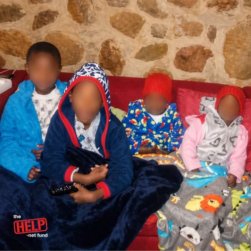 Children resting together in a warm safe space